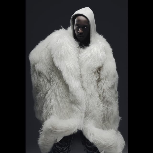 KIMANII in an ice-white fur silhouette